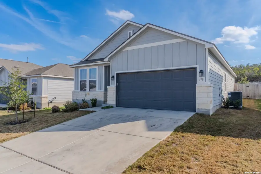 Front exterior of a new home in The Meadows at Hunters Ranch, San Antonio, TX, highlighting curb appeal (Image 1). Front exterior of a new home in The Meadows at Hunters Ranch, San Antonio, TX, highlighting curb appeal (Image 1).