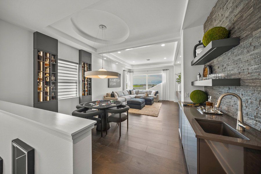 Representative furnished interior of a home built from the Aviso by Homes by Towne in Shellstone at Waterside, Sarasota (Image 10).