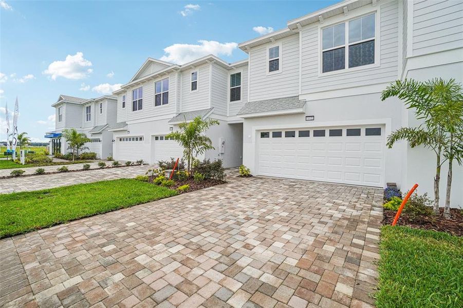 Front exterior of a new home in Isla Mirada, San Antonio, FL, highlighting curb appeal (Image 1).