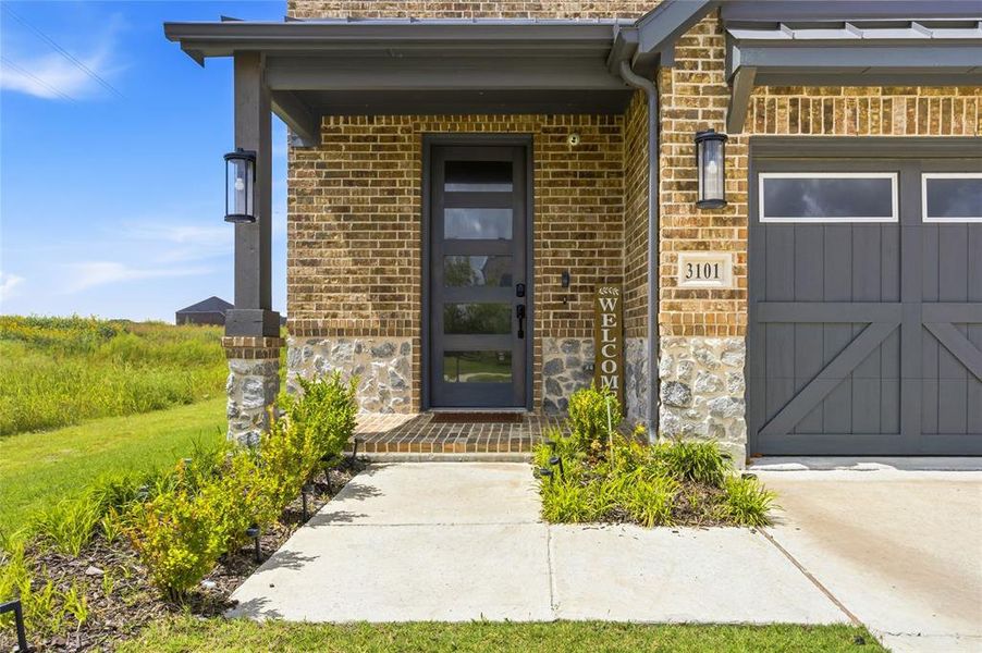 Exterior details and patio area of a home in The Villages of Hurricane Creek, Anna (Image 3).