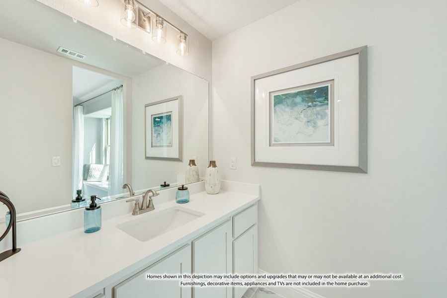 Bathroom vanity with white cabinets, quartz countertop, single sink, large mirror, and wall art Bathroom vanity with white cabinets, quartz countertop, single sink, large mirror, and wall art