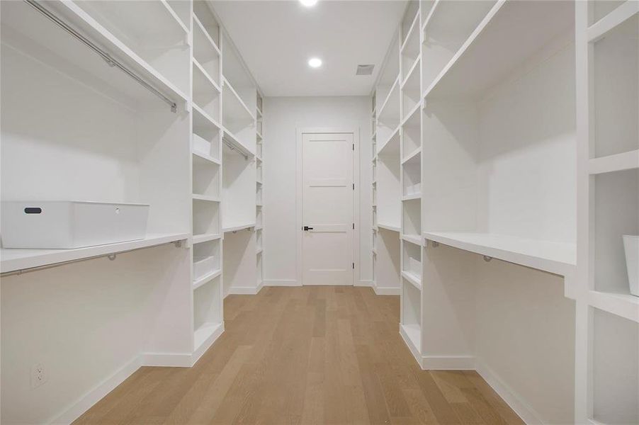 Walk in closet featuring light hardwood / wood-style floors