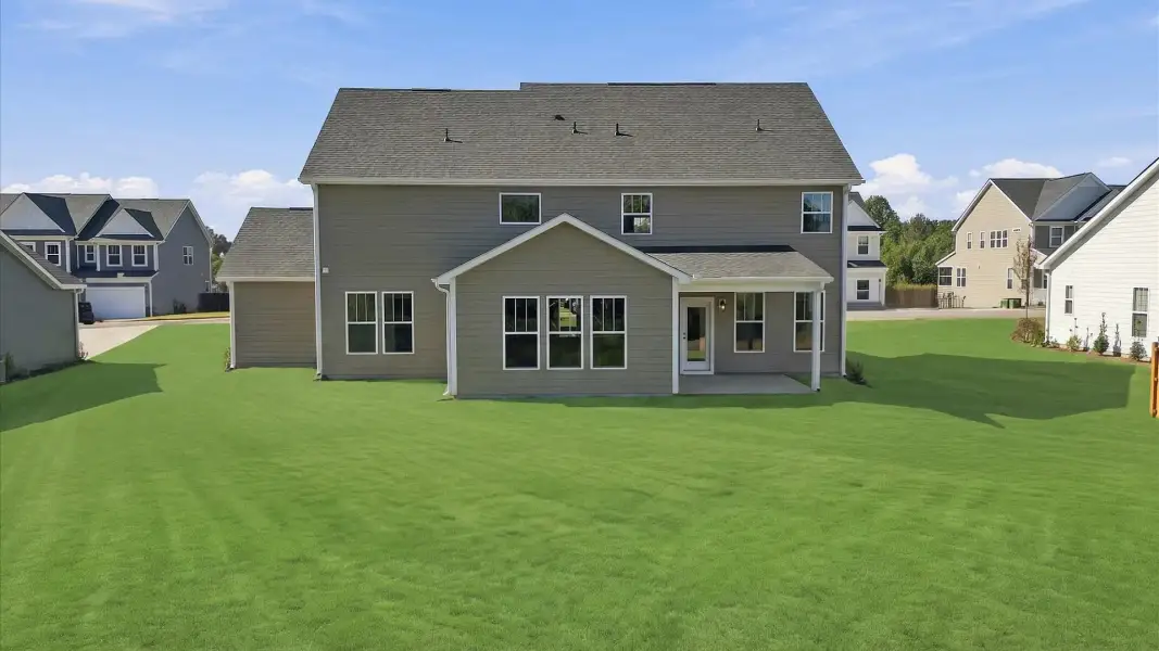 Superior curb appeal continues to the back with a refined, covered outdoor living space by DRB Homes Superior curb appeal continues to the back with a refined, covered outdoor living space by DRB Homes