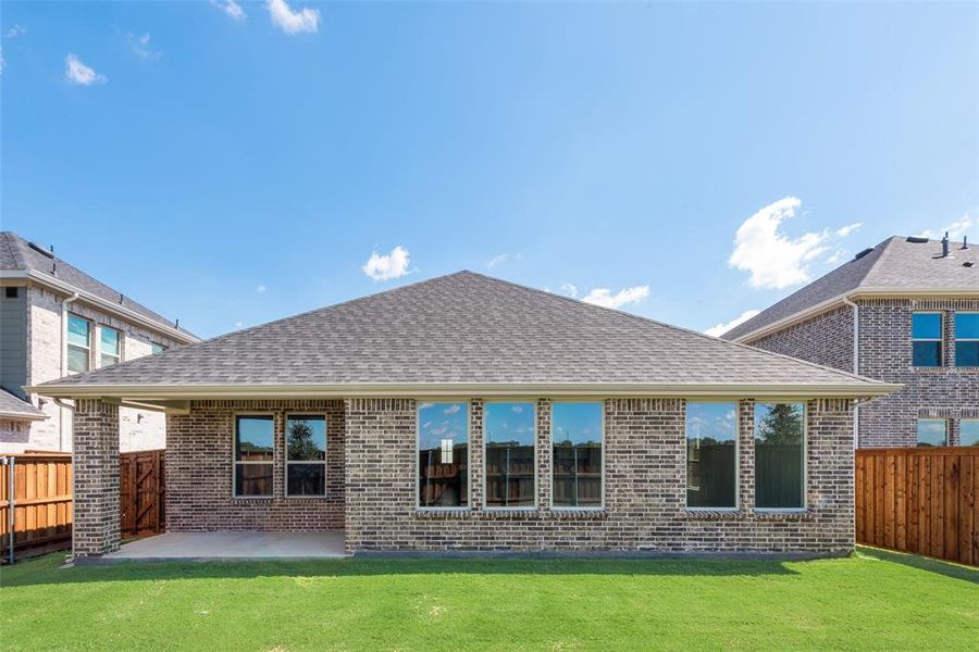 Exterior details and patio area of a home in Spiritas Ranch, Little Elm (Image 3).