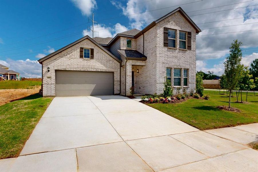 Front exterior of a new home in Kings Way, Denton, TX, highlighting curb appeal (Image 18). Front exterior of a new home in Kings Way, Denton, TX, highlighting curb appeal (Image 18).