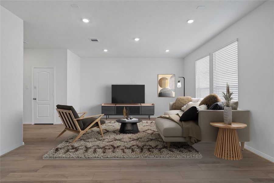 Gather the family and guests together in your lovely living room! Featuring high ceilings, recessed lighting, custom paint, gorgeous floors and large windows that provide plenty of natural lighting throughout the day.