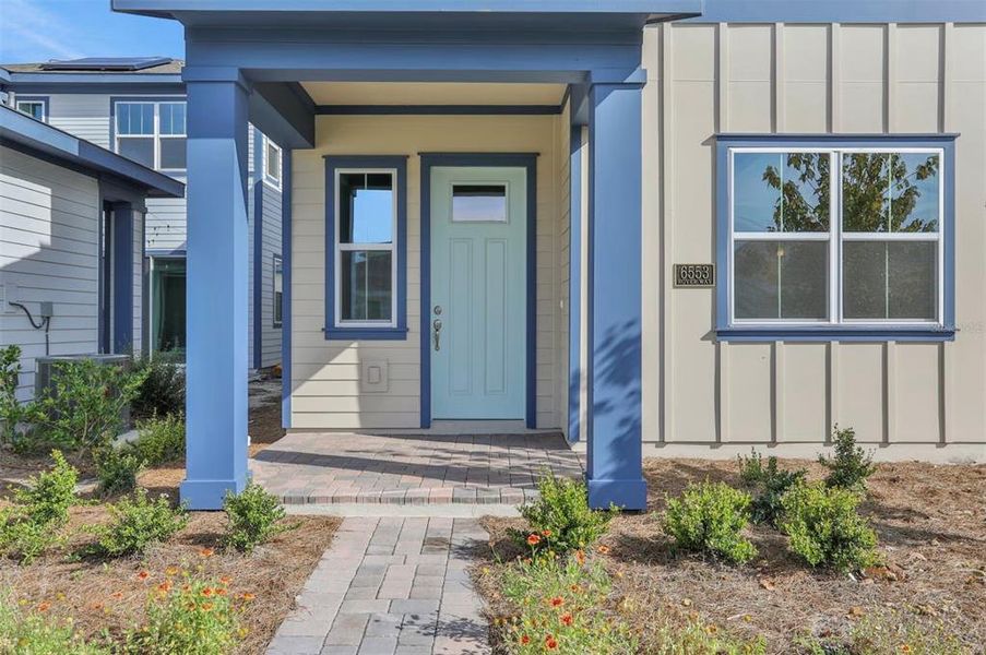 Exterior details and patio area of a home in Weslyn Park at Sunbridge (Craft Homes), St. Cloud (Image 3).