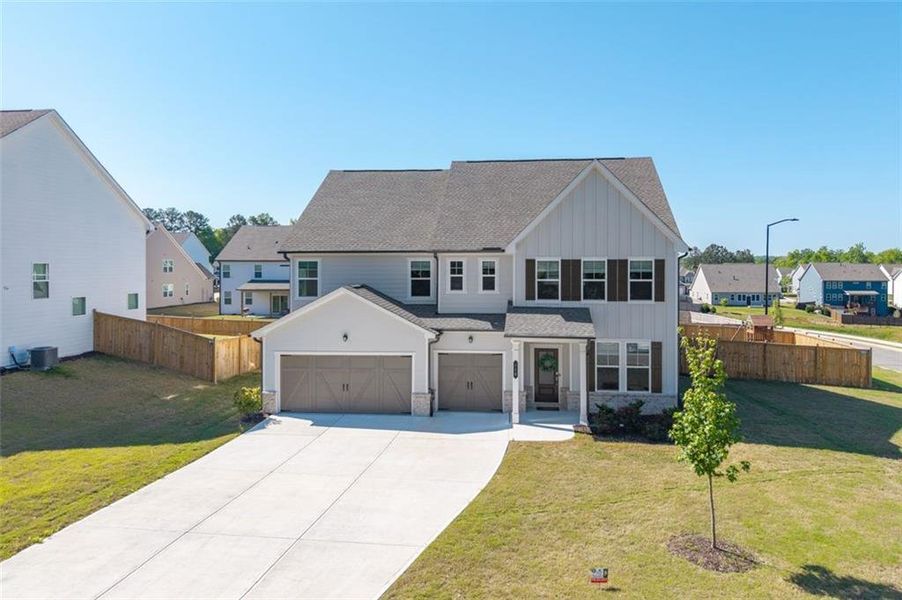Front exterior of a new home in , Dallas, GA, highlighting curb appeal (Image 27).