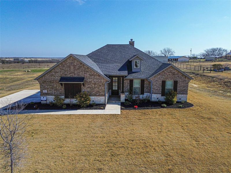 View of front of home featuring a front lawn