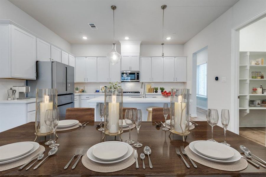 Dining area with recessed lighting and visible vents