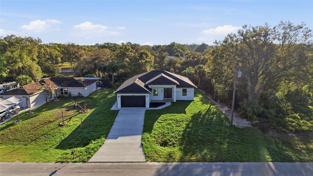 Front exterior of a new home in , Labelle, FL, highlighting curb appeal (Image 23).