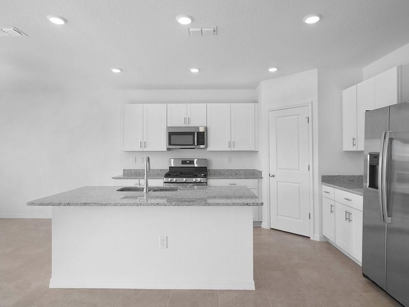 Representative furnished interior of a home built from the Azalea by Taylor Morrison in Palm Wind, Hudson (Image 36).