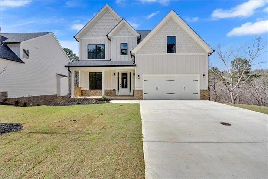 Front exterior of a new home in , Cartersville, GA, highlighting curb appeal (Image 1).