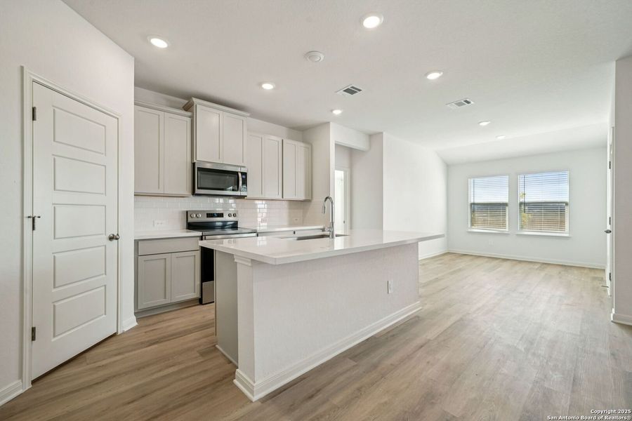 Furnished interior view inside a new home in Estancia Ranch - Premier Series, San Antonio (Image 13). Furnished interior view inside a new home in Estancia Ranch - Premier Series, San Antonio (Image 13).