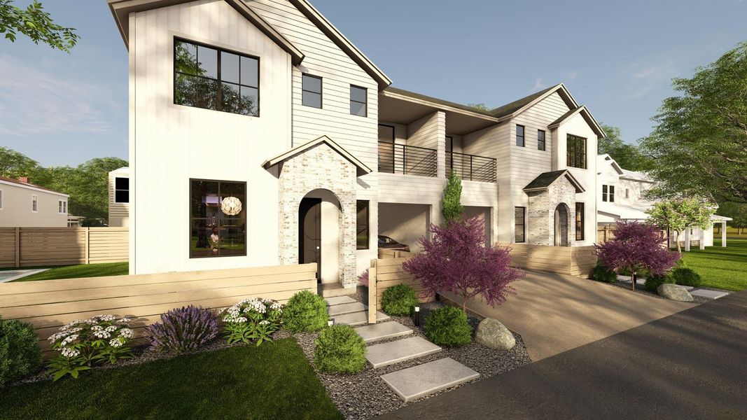 View of front facade featuring a balcony and stone siding