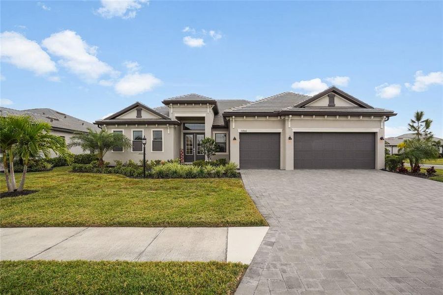 Front exterior of a new home in , Lakewood Ranch, FL, highlighting curb appeal (Image 26). Front exterior of a new home in , Lakewood Ranch, FL, highlighting curb appeal (Image 26).