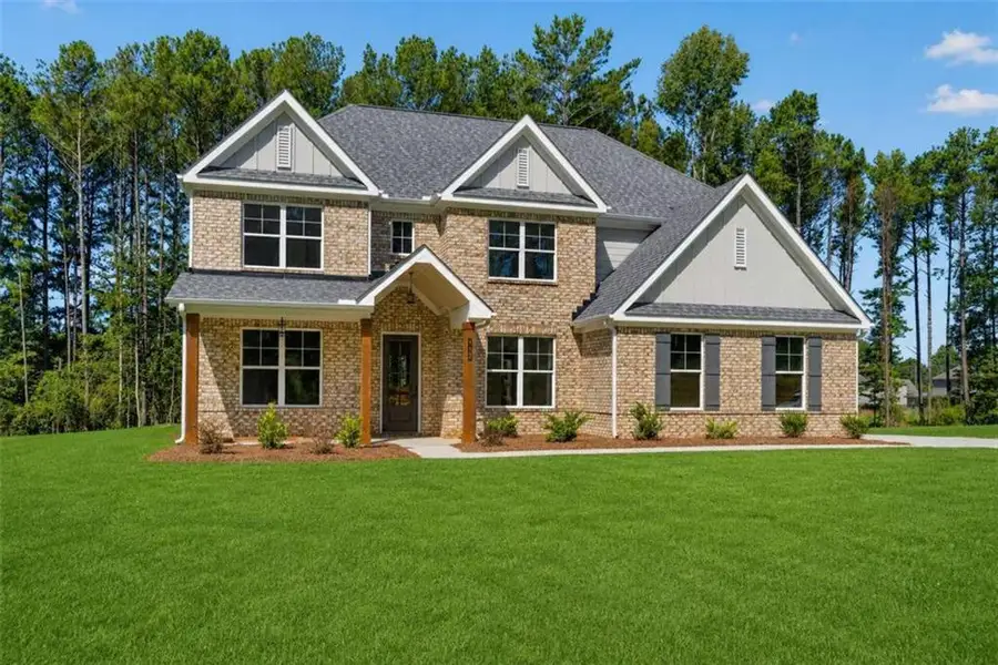 Front exterior of a new home in Patillo Manor, Stockbridge, GA, highlighting curb appeal (Image 1). Front exterior of a new home in Patillo Manor, Stockbridge, GA, highlighting curb appeal (Image 1).
