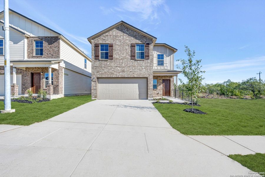 Front exterior of a new home in Paloma Park, Converse, TX, highlighting curb appeal (Image 1).