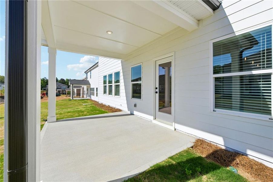 Exterior details and patio area of a home in Vines at Mill Creek - Estate Series, Braselton (Image 31).