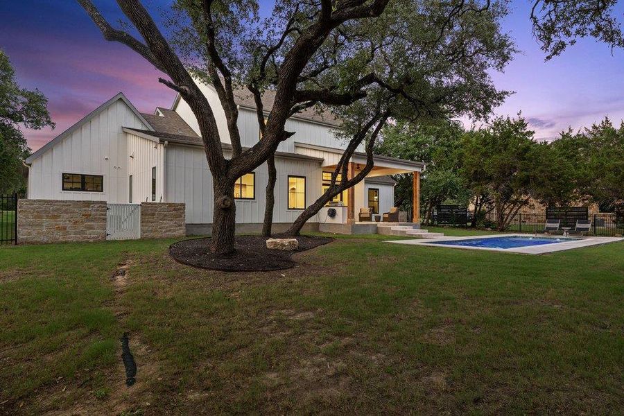 A private oasis boasts a refreshing pool, inviting patio, and lush lawn, ideal for outdoor enjoyment. A private oasis boasts a refreshing pool, inviting patio, and lush lawn, ideal for outdoor enjoyment.
