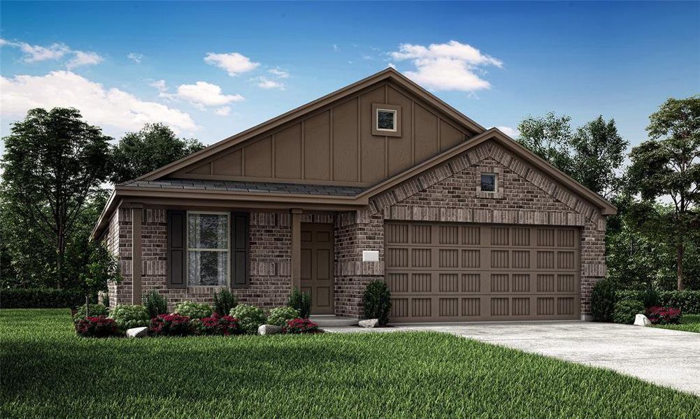 View of front of house featuring a front lawn and a garage