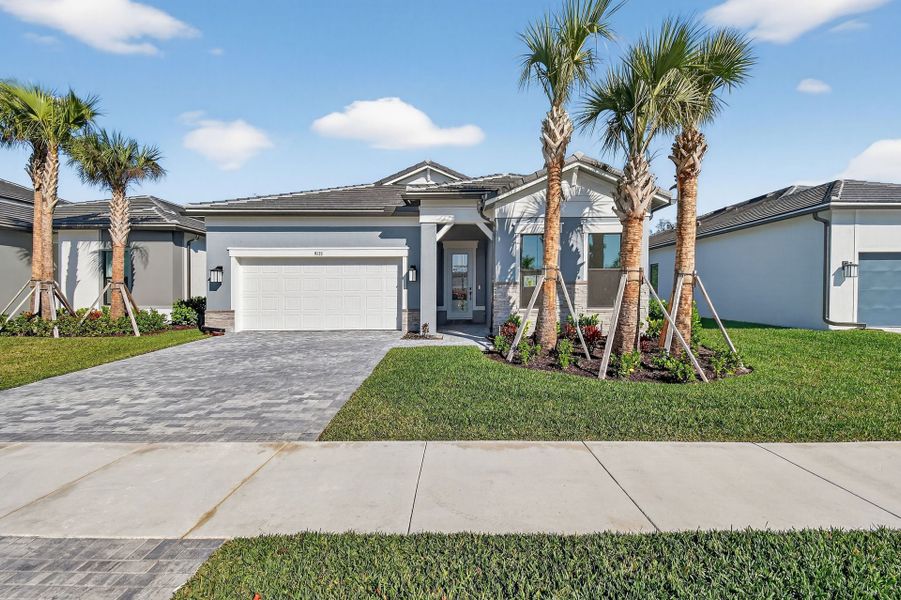 Front exterior of a new home in Greyhawk Landing, Lake Worth, FL, highlighting curb appeal (Image 24).