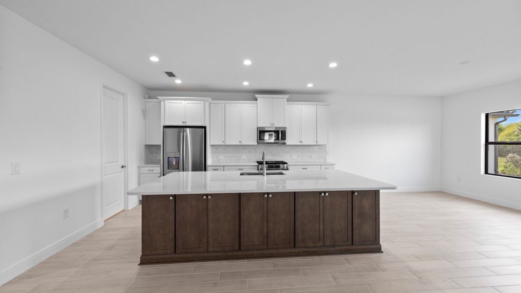 Furnished interior view inside a new home in SkySail, Naples (Image 9).