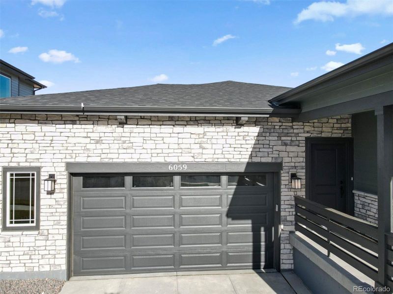 Exterior details and patio area of a home in The Cottages Collection at Ridgeline Vista, Brighton (Image 28).