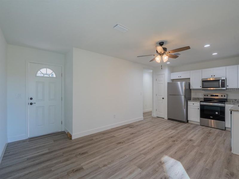 Spacious, unfurnished interior of a new home in , Fort McCoy (Image 8).