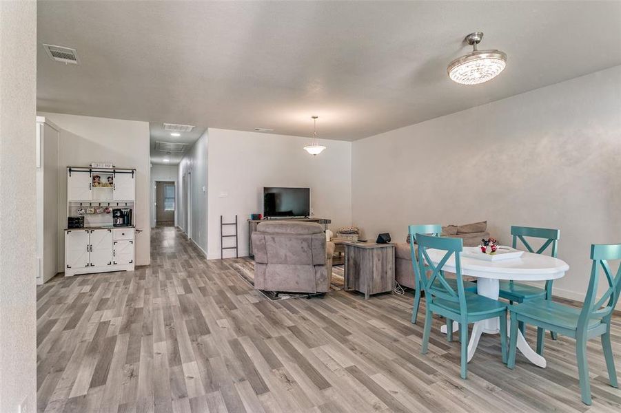 Dining space featuring light wood-type flooring and baseboards Dining space featuring light wood-type flooring and baseboards