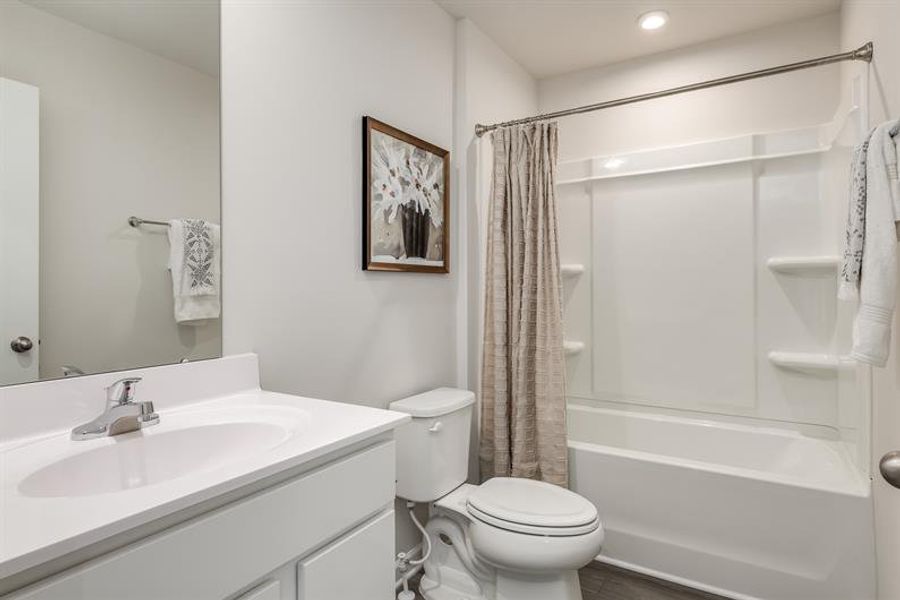 Representative furnished interior of a home built from the Tate by Ryan Homes in Middle Creek Village Coastal Cottages & Villas, Bolivia (Image 22).