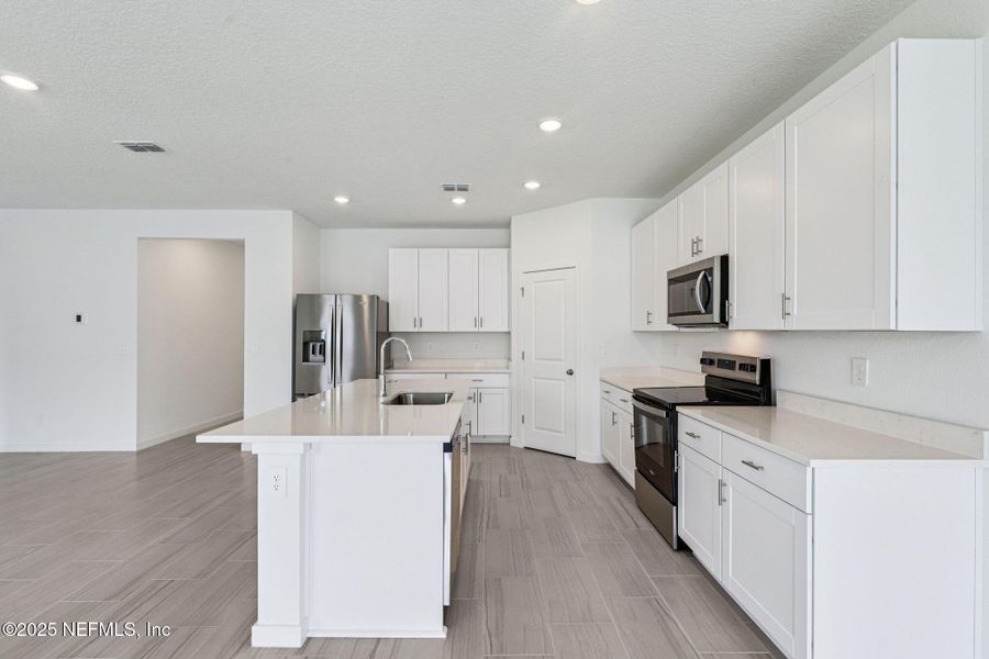 Furnished interior view inside a new home in Flagler Village - Signature Series, Palm Coast (Image 2).