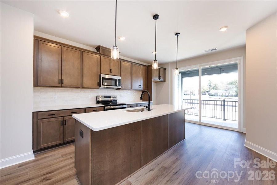 Kitchen with Access to the Covered Outdoor Living Kitchen with Access to the Covered Outdoor Living