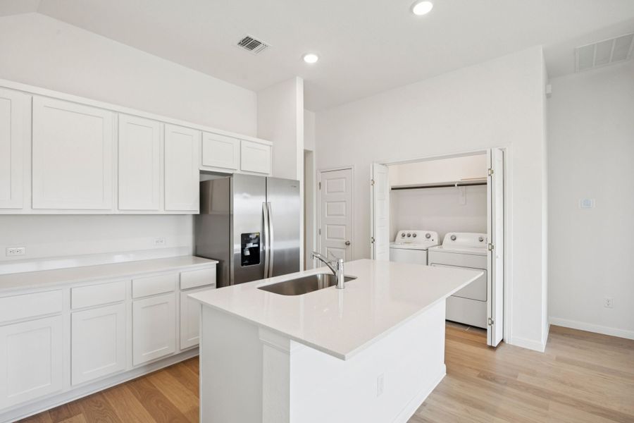 Kitchen in the Pinehurst home plan by Trophy Signature Homes - REPRESENTATIVE PHOTO Kitchen in the Pinehurst home plan by Trophy Signature Homes - REPRESENTATIVE PHOTO