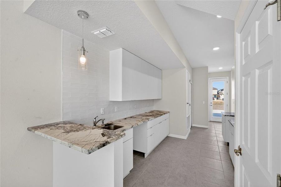 Furnished interior view inside a new home in , Davenport (Image 6).