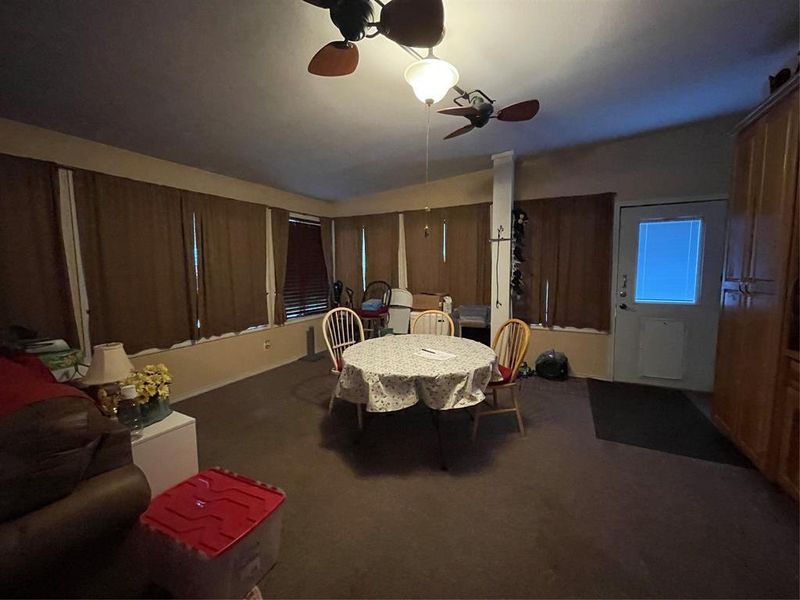 Dining area featuring carpet floors and ceiling fan Dining area featuring carpet floors and ceiling fan
