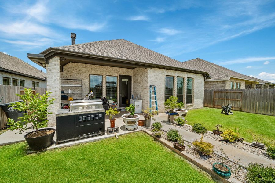 Exterior details and patio area of a home in Marvida, Cypress (Image 3).