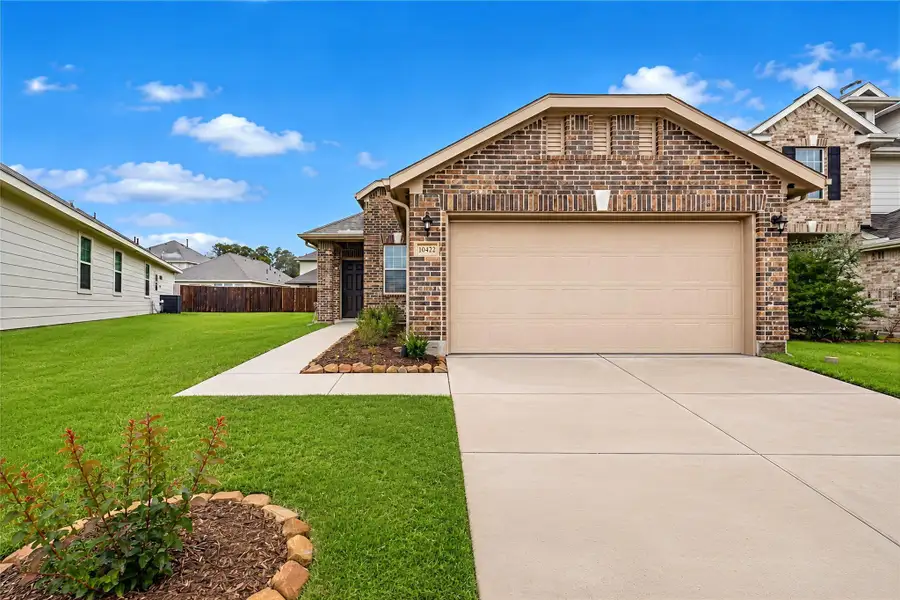 Front exterior of a new home in Willowpoint, Tomball, TX, highlighting curb appeal (Image 1). Front exterior of a new home in Willowpoint, Tomball, TX, highlighting curb appeal (Image 1).