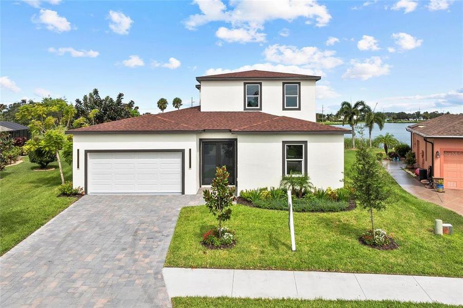 Front exterior of a new home in , Palmetto, FL, highlighting curb appeal (Image 2). Front exterior of a new home in , Palmetto, FL, highlighting curb appeal (Image 2).