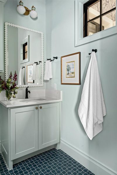 Bathroom with vanity and baseboards