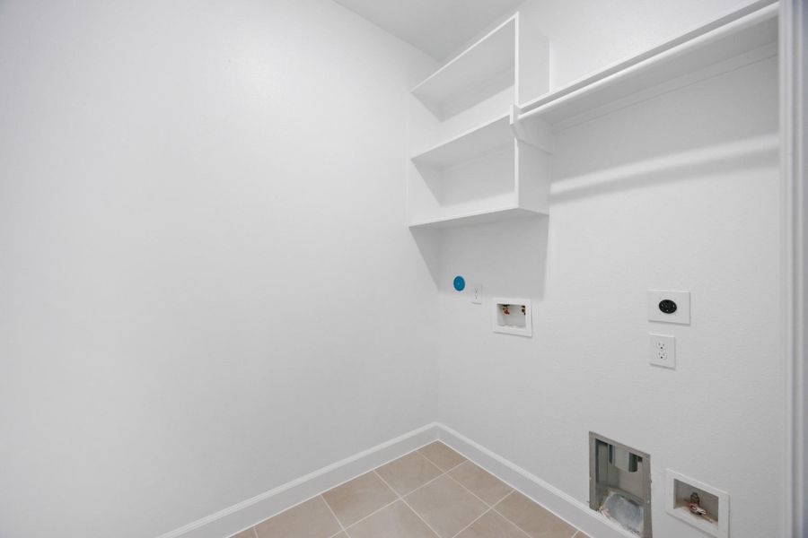 Clean design meets clever function in this dedicated laundry room. With built-in shelving and plenty of space to fold, it actually makes chores feel…doable. Clean design meets clever function in this dedicated laundry room. With built-in shelving and plenty of space to fold, it actually makes chores feel…doable.