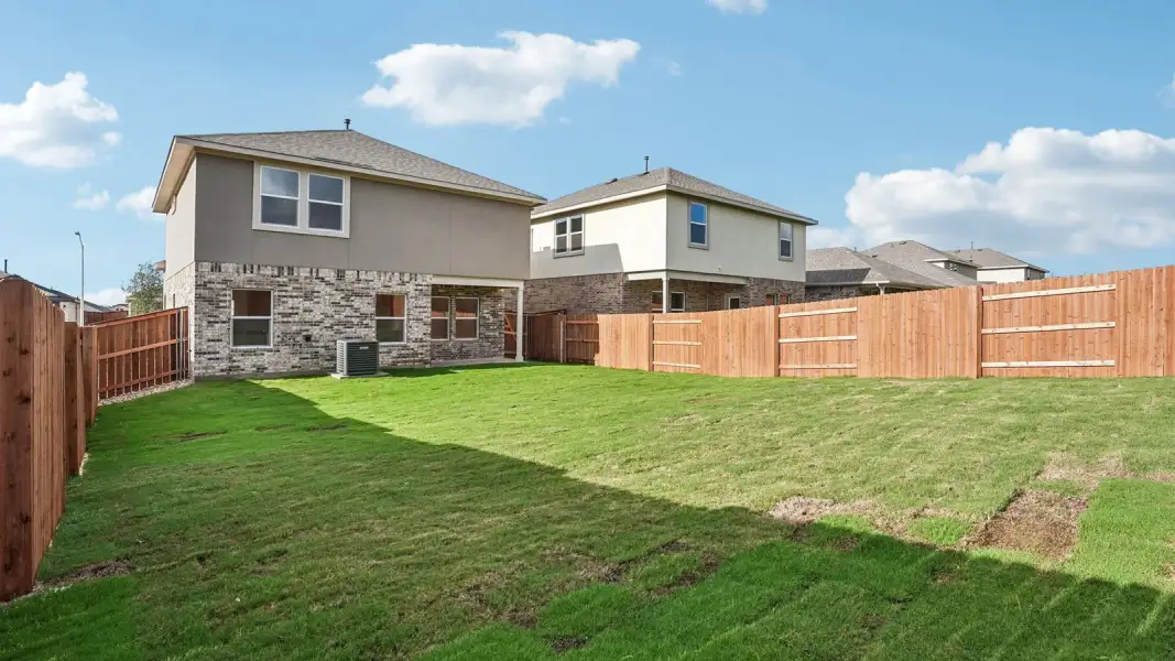 Exterior details and patio area of a home in Bar W Ranch, Leander (Image 20).