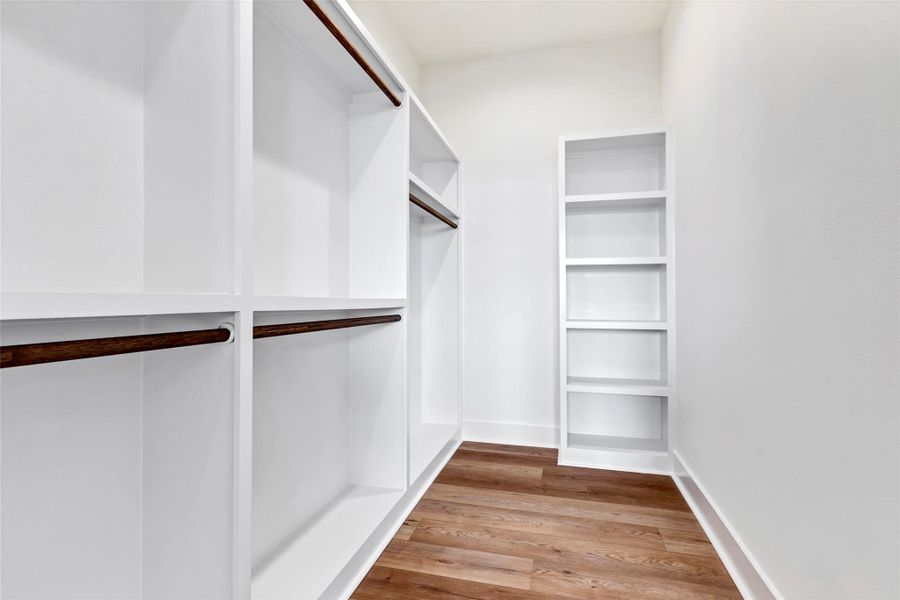 Spacious walk-in closet offering ample storage for all your personal items, keeping everything organized and easily accessible. Spacious walk-in closet offering ample storage for all your personal items, keeping everything organized and easily accessible.