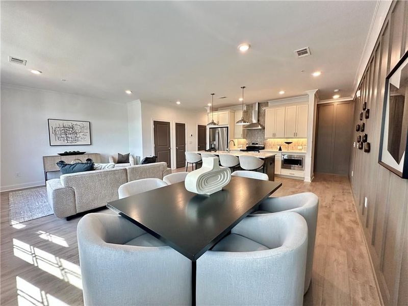 Open Concept Floor Plan showcasing 6 Person dining room *Photos Showcase Warm Wheat Design Collection from a different Staged Model Home Site*