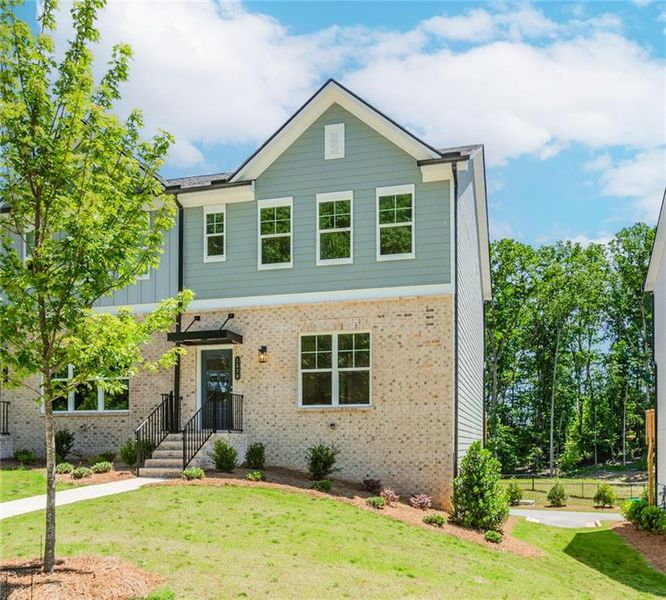Front exterior of a new home in Hillcrest Landing, Sugar Hill, GA, highlighting curb appeal (Image 27). Front exterior of a new home in Hillcrest Landing, Sugar Hill, GA, highlighting curb appeal (Image 27).