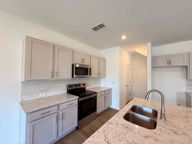 Kitchen featuring Milan Collection Finishes