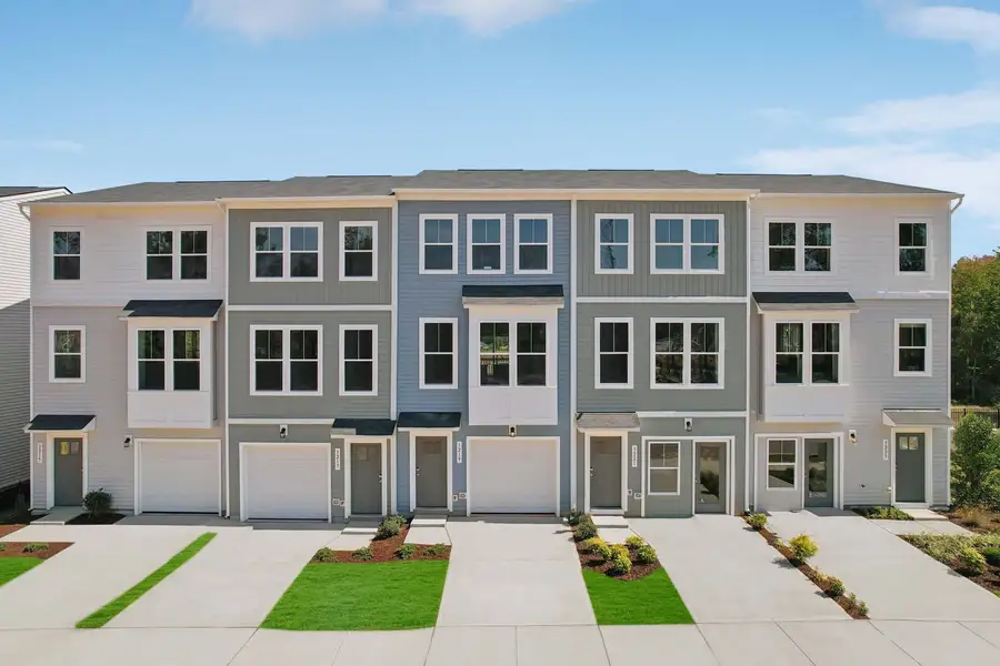 Front exterior of a new home in Haddonstone, Raleigh, NC, highlighting curb appeal (Image 1). Front exterior of a new home in Haddonstone, Raleigh, NC, highlighting curb appeal (Image 1).