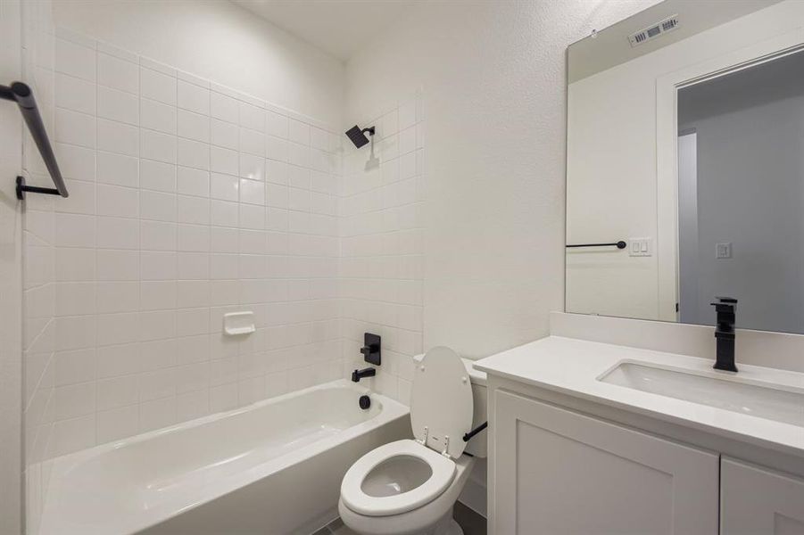 Bathroom with shower / bathtub combination and vanity Bathroom with shower / bathtub combination and vanity