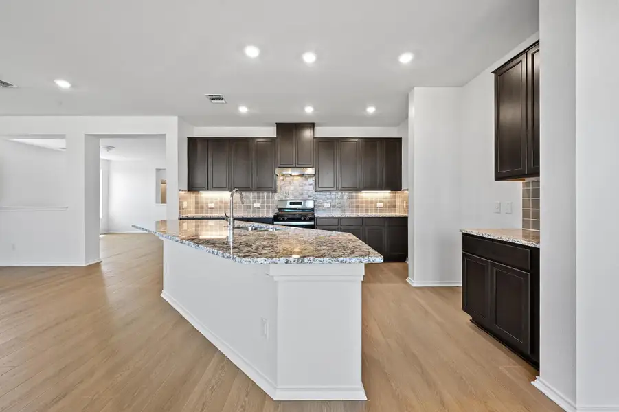 Furnished interior view inside a new home in Salerno - Classic Collection, Round Rock (Image 7). Furnished interior view inside a new home in Salerno - Classic Collection, Round Rock (Image 7).