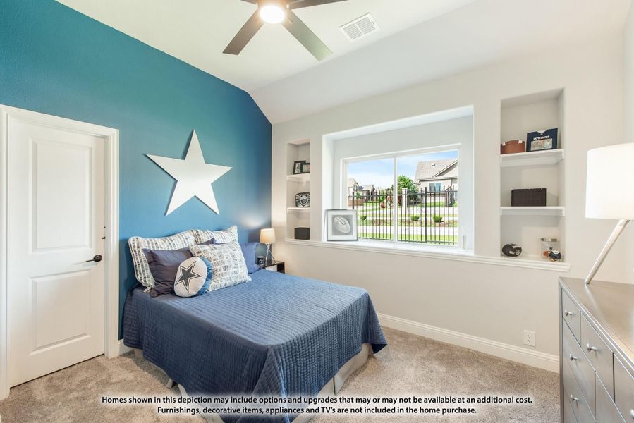 Bedroom with blue accent wall, built-in shelves, ceiling fan, and large window with neighborhood view